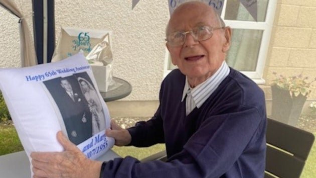 Couple Celebrate 65th Wedding Anniversary Physically-Distanced With Whisky And Cuddle Cushions