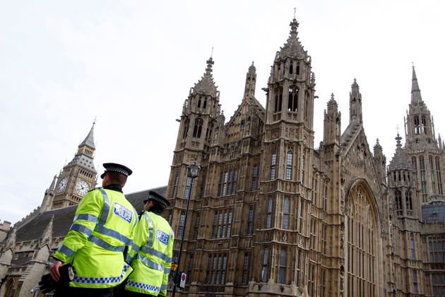 Police officers outside the Houses of Parliament. A Conservative MP has been arrested on suspicion of rape.