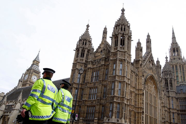 Police officers outside the Houses of Parliament. A Conservative MP has been arrested on suspicion of rape.