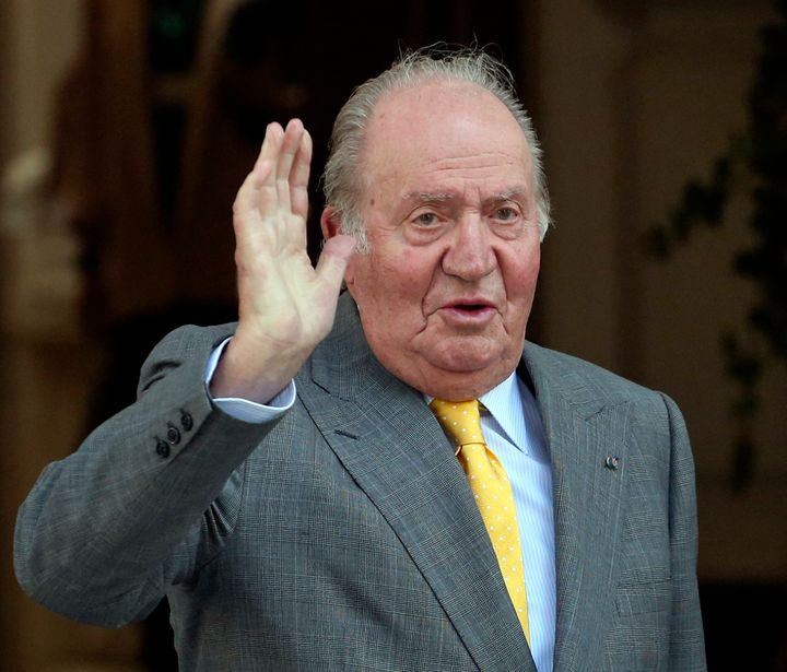 In this March 10, 2018, file photo, Spain's former monarch King Juan Carlos waves upon his arrival to the Academia Diplomatica de Chile, in Santiago where he met with President-elect Sebastian Pinera. (AP Photo/Esteban Felix, File)