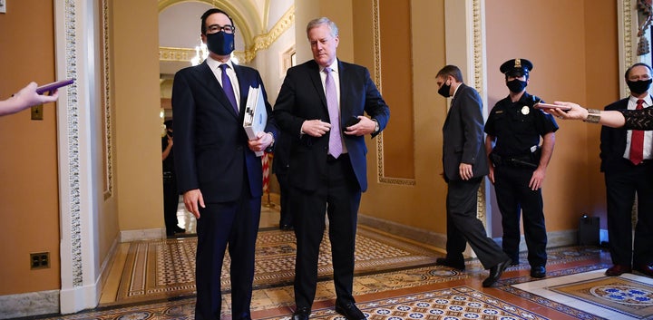 Treasury Secretary Steven Mnuchin (left) and White House Chief of Staff Mark Meadows speak to reporters on Monday about the o