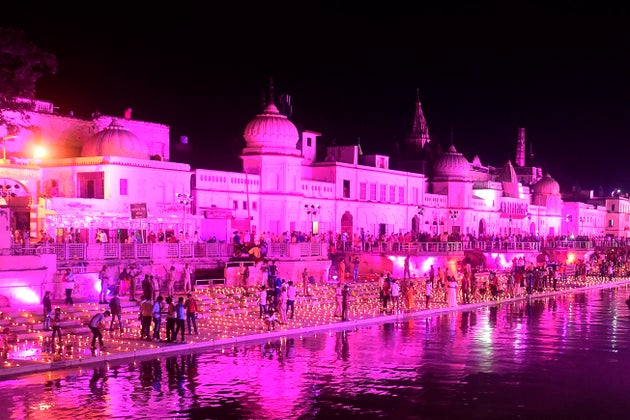 Hindu devotees light earthen lamps on the banks of the River Sarayu on the eve before the groundbreaking...