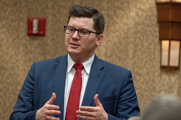Kansas State Treasurer Jake LaTurner talks with members of the 2nd congressional district during meeting at the annual GOP co