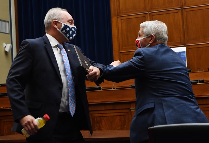 Rep. Steve Scalise (R-La.), left, elbow-bumps Anthony Fauci, director of the National Institute for Allergy and Infectious Diseases, after a House Subcommittee on the Coronavirus Crisis hearing on Capitol Hill in Washington, D.C., on July 31.