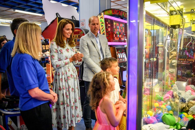 Kate and William watch children play a grab a teddy game at Island Leisure Amusement Arcade during their visit to Barry Island, South Wales.&nbsp;