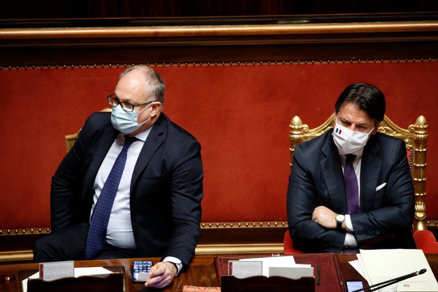 The Italian deputy Roberto Gualtieri and the Italian premier Giuseppe Conte, both with surgical mask,...