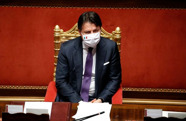 Italian Prime Minister Giuseppe Conte with protective mask in the Senate Chamber during the information...