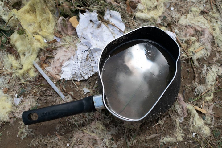 A cooking pot from one of the homes destroyed by a tornado from Hurricane Isaias was tossed across Sunrise Road into a cotton field in North Carolina.