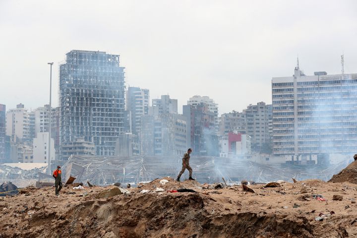 A soldier walks at the devastated site of the explosion in the port of Beirut, Lebanon, Thursday Aug.6, 2020. French President Emmanuel Macron came in Beirut to offer French support to Lebanon after the deadly port blast.(AP Photo/Thibault Camus, Pool)