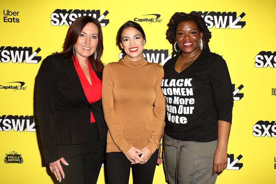 Cori Bush, right, joins Amy Vilela, left, and Rep. Alexandria Ocasio-Cortez (D-N.Y.) at the premiere...