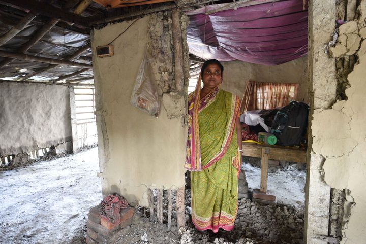 A woman standing in her home damaged due to Cyclone Amphan, at Kakdwip in the Sunderbans, South 24 Parganas district, on May 22, 2020 in Kakdwip, India. 