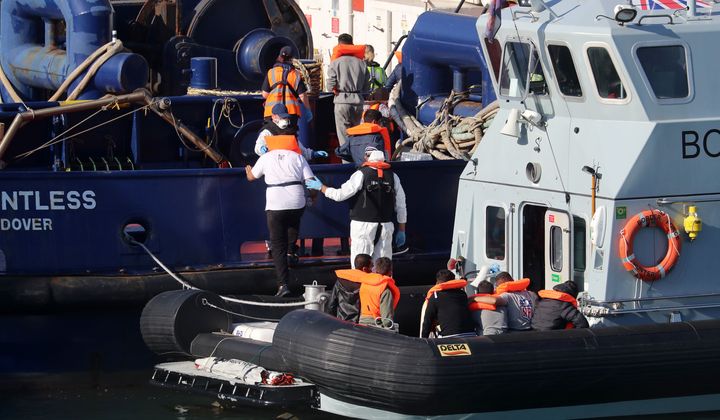 A Border Force vessel brings a group of men thought to be migrants into Dover, Kent.