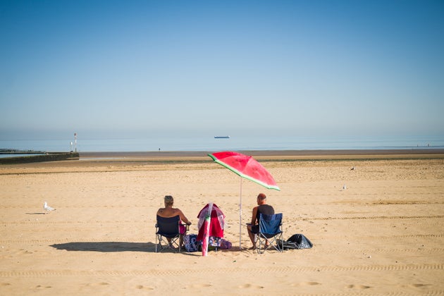 A couple stake an early claim on the best spot on the beach on August 07, 2020 in Margate&nbsp;