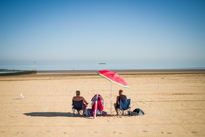 A couple stake an early claim on the best spot on the beach on August 07, 2020 in Margate 