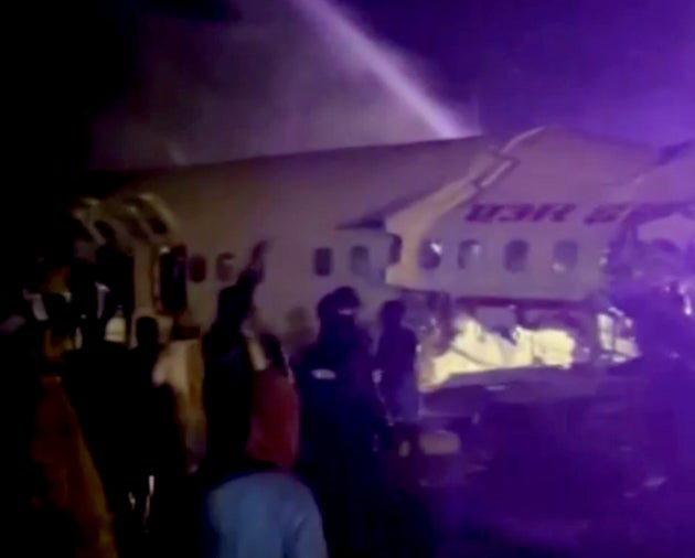 A passenger plane that crashed after it overshot the runway is seen at Calicut International Airport in the southern state of Kerala, India.