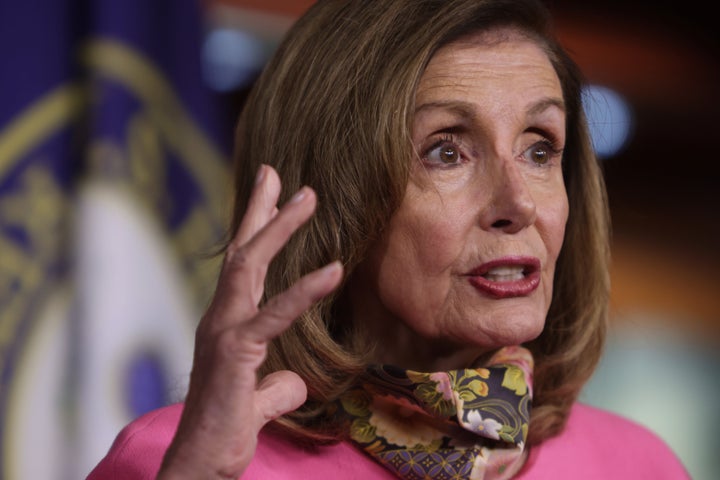 Speaker of the House Nancy Pelosi (D-Calif.) participates in a news conference on Friday. She -- along with Treasury Secretary Steven Mnuchin, Senate Minority Leader Sen. Chuck Schumer and White House Chief of Staff Mark Meadows -- are trying to negotiate an agreement to move forward on a new relief package to help people and businesses weather the COVID-19 pandemic.