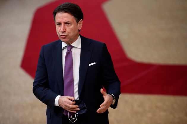 Italy's Prime Minister Giuseppe Conte release a steatment as he arrives at the European Union Council...