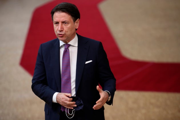 Italy's Prime Minister Giuseppe Conte release a steatment as he arrives at the European Union Council...