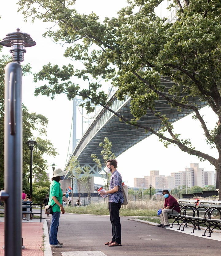 Zohran Mamdani, the democratic socialist who won the Democratic primary for New York's 36th Assembly District, canvasses in one of the Astoria neighborhood's parks near the utility complex.