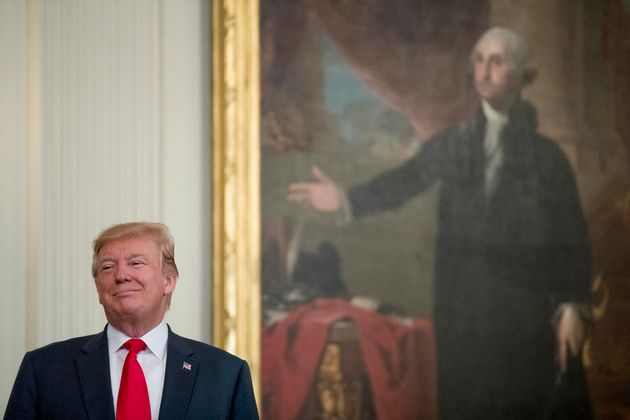 President Donald Trump stands near a portrait of George Washington during a Wounded Warrior Project Soldier Ride event in the East Room of the White House, Thursday, April 18, 2019, in Washington. (AP Photo/Andrew Harnik)