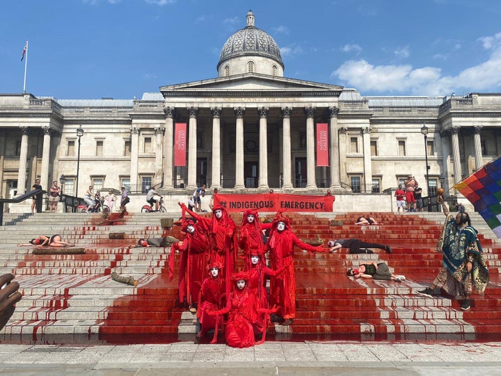 Extinction Rebellion Activists Drench Trafalgar Square In Fake