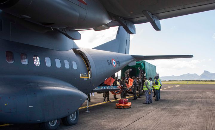 This photo provided by the French Defense Ministry shows a French military transport aircraft carrying pollution control equipment after landing in Mauritius island, Sunday Aug.9, 2020. 
