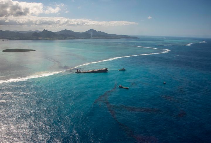 This photo provided by the French Defense Ministry shows oil leaking from the MV Wakashio, a bulk carrier ship that recently ran aground off the southeast coast of Mauritius,, Sunday Aug.9, 2020. 