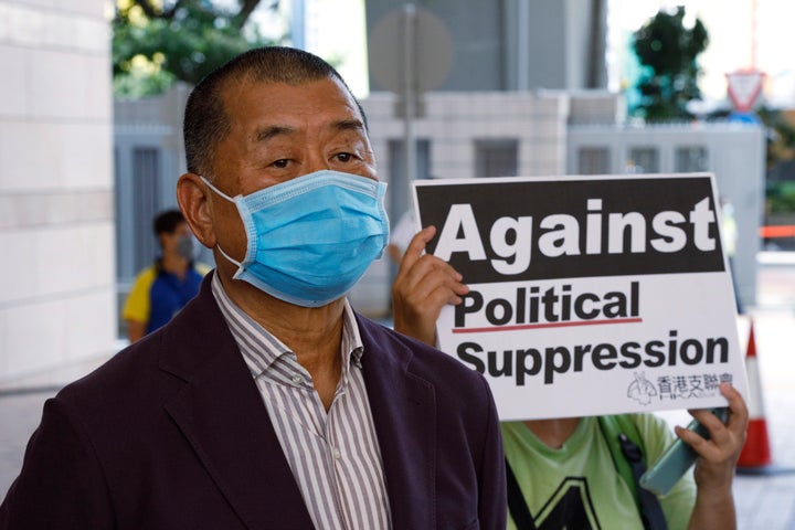 Hong Kong media tycoon Jimmy Lai, founder of the local newspaper Apple Daily, arrives a district court in Hong Kong on July 30, 2020, on charges of inciting others to participate in an unlawful assembly. He and other activists organized the June 4 Tiananmen massacre memorial this year, which was banned by police because of anti-virus social distancing reasons.