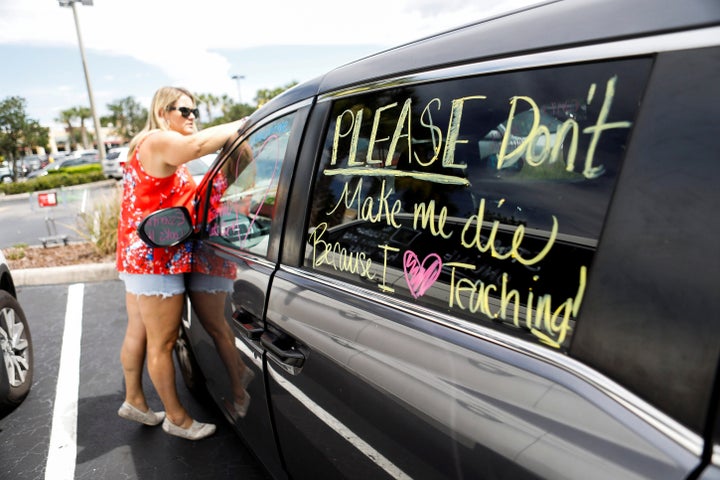 Florida teachers, whose unions are against their members returning to work, held a car parade protest in front of the Pasco County School District office in Land O' Lakes, Florida on July 21. 