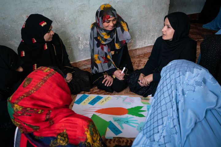 Rowaida (right) along with other women and girls participating in World Vision organized Community change groups in Herat, Afghanistan