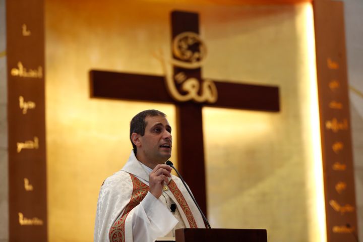 Lebanese priest Marwan Mouawad speaks during Sunday Mass at Saint Maron-Baouchrieh Church, which was damaged by last Tuesday's explosion that hit the Beirut seaport.
