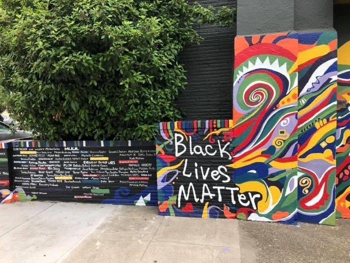 The mural includes the names of Martin Luther King Jr., <a href="https://www.huffpost.com/entry/story-emmett-till-murder-under-threat_n_5ddda083e4b0913e6f756a46" target="_blank" rel="noopener noreferrer">Emmett Till</a> and <a href="https://www.huffpost.com/topic/breonna-taylor" target="_blank" rel="noopener noreferrer">Breonna Taylor.</a> Colored bricks are reserved for the names of people from Portland.