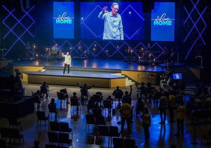 Pastor Danny Carroll, of California's Water of Life Community Church, prays during a service on Sunday, May 31.