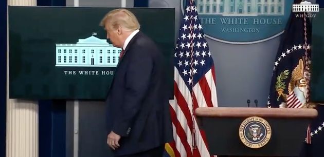 President Trump is escorted from the White House press briefing room Monday, shortly after starting a news conference.