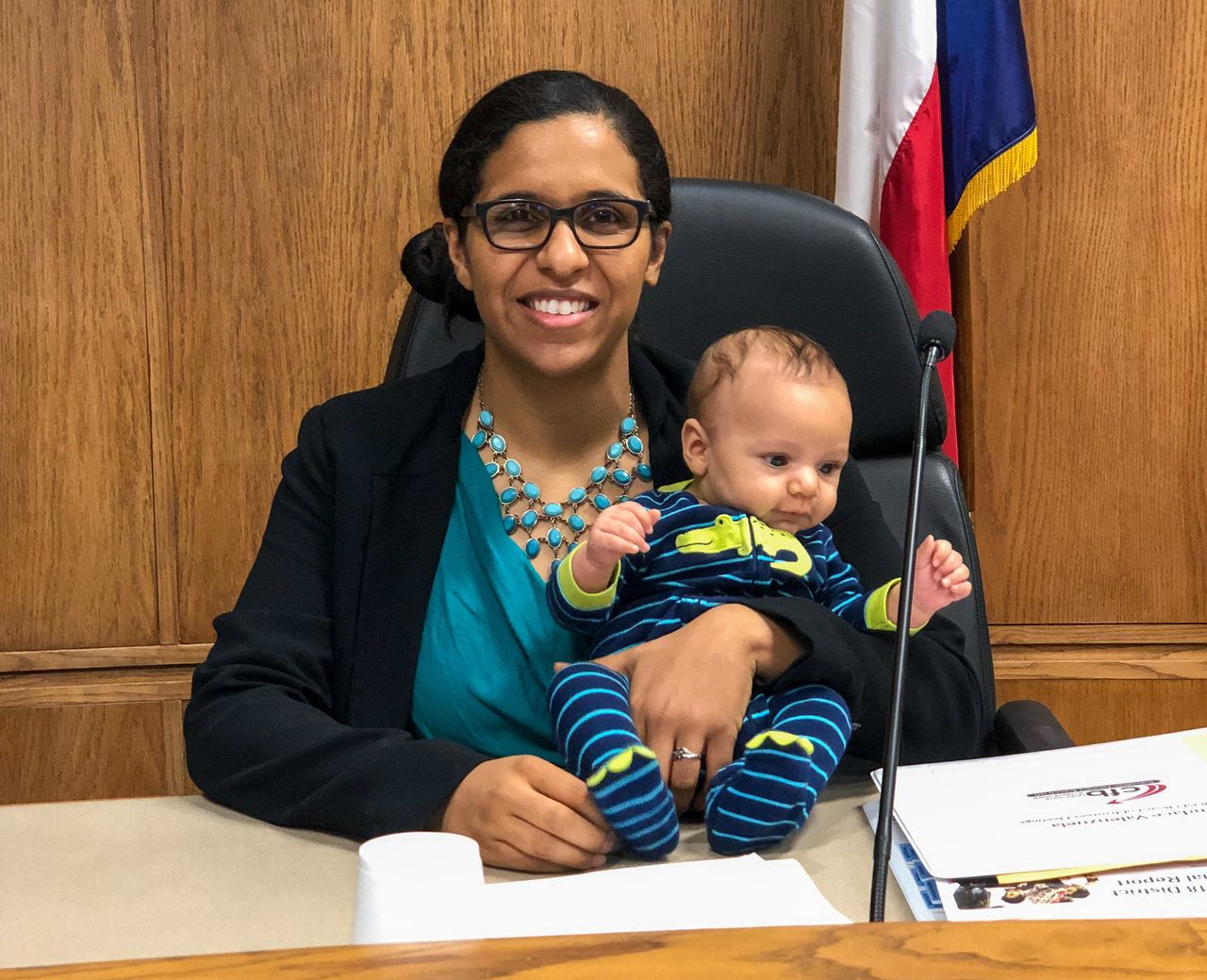 Valenzuela at a Carrollton-Farmers Branch school board meeting in August 2019 with her baby boy.