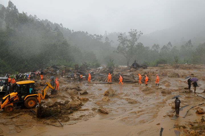 Rescuers work at the site of a mudslide triggered by heavy monsoon rain in Idukki district of Kerala on August 7, 2020.