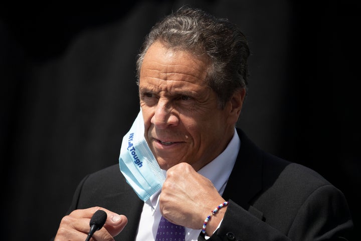 In this June 15, 2020, file photo, New York Gov. Andrew Cuomo removes a mask as he holds a news conference in Tarrytown, N.Y.