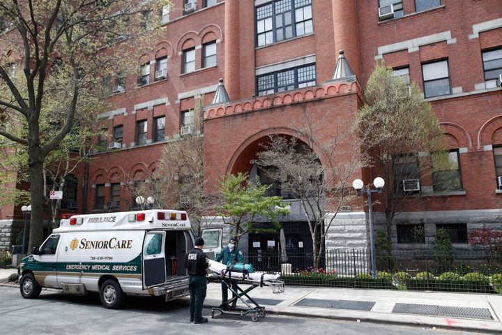 In this April 17, 2020, file photo, emergency medical workers arrive at Cobble Hill Health Center in the Brooklyn borough of New York. (AP Photo/John Minchillo, File)