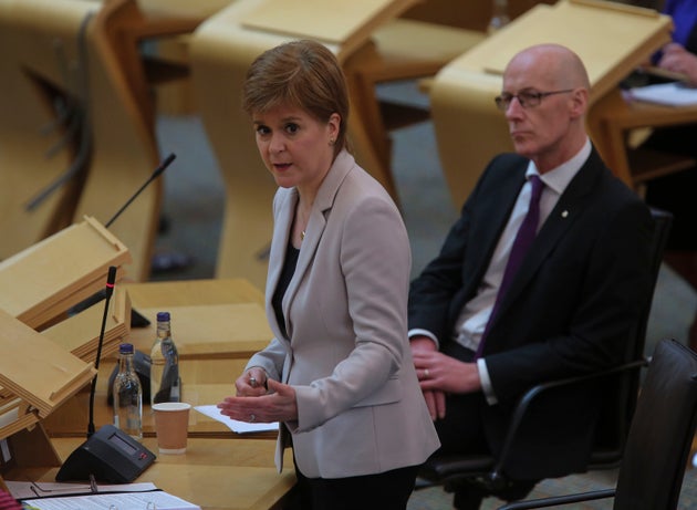 First Minister Nicola Sturgeon alongside Deputy First Minister John Swinney during First Minister's Questions at the Scottish Parliament, Edinburgh.