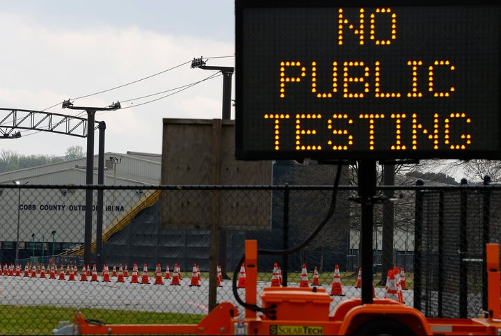 A sign is visible outside of Jim R. Miller Park during the first day of drive-thru coronavirus testing in Marietta, Georgia. 