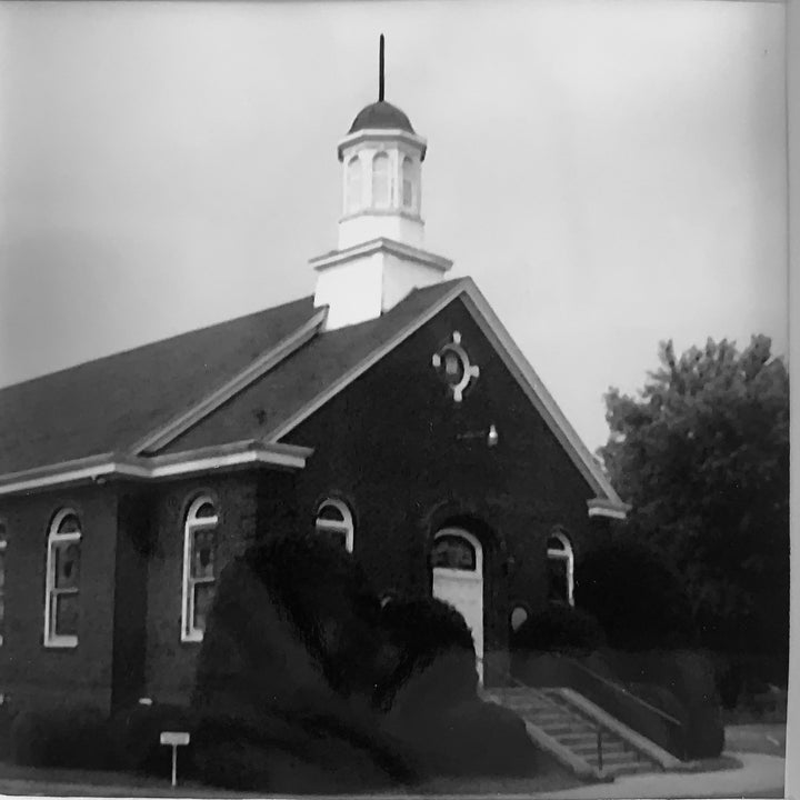 The writer's family attended this church for four generations. Her great grandmother was a charter member back around 1912. She took this photo and kept it on the wall of her office.