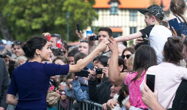 The Duchess of Sussex is used to charming crowds. 