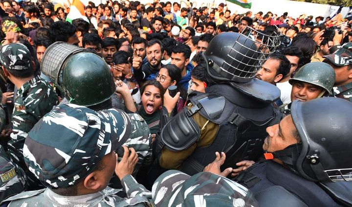 NEW DELHI, INDIA - FEBRUARY 10: Delhi police personnel and demonstrators in a scuffle during a march to Parliament against the Citizenship Amendment Act, NRC and NPR near Jamia Millia Islamia on February 10, 2020 in New Delhi, India. (Photo by Raj K Raj/Hindustan Times via Getty Images)