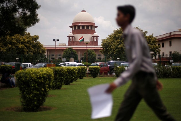 A man walks inside the premises of the Supreme Court in New Delhi, India, July 17, 2018. REUTERS/Adnan