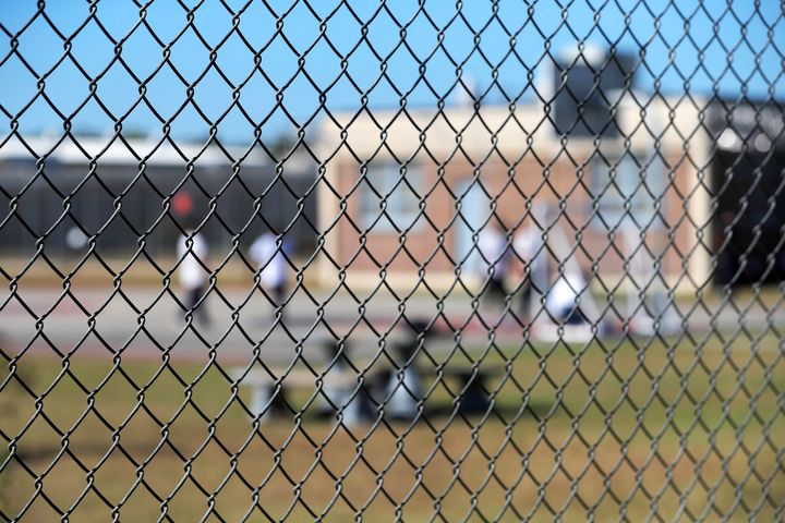 In this Sept. 26, 2019, file photo, detainees sit in a yard during a media tour inside the Winn Correctional Center in Winnfield.