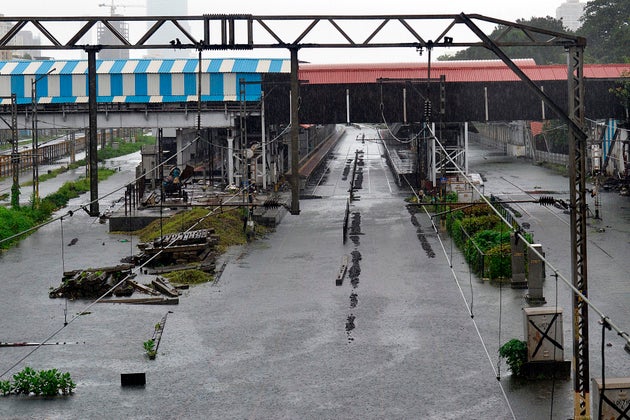 General view of the railway tracks flooded during a heavy monsoon rainfall in Mumbai on August 4,