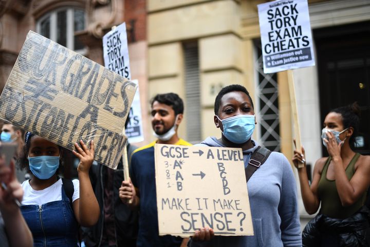 People take part in a protest in Westminster in London over the government's handling of A-level results. 