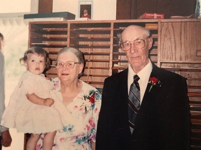 The writer, as a child, with her adoptive Mennonite grandparents.