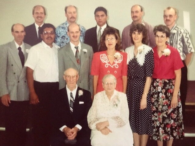 The writer's father’s immediate family. She reconnected with her uncle Cliff, second from the left in the middle row. Her adoptive father appears in far right, in the back row.