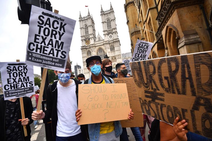 People take part in a protest in Westminster in London over the government's handling of A-level result on Friday. 
